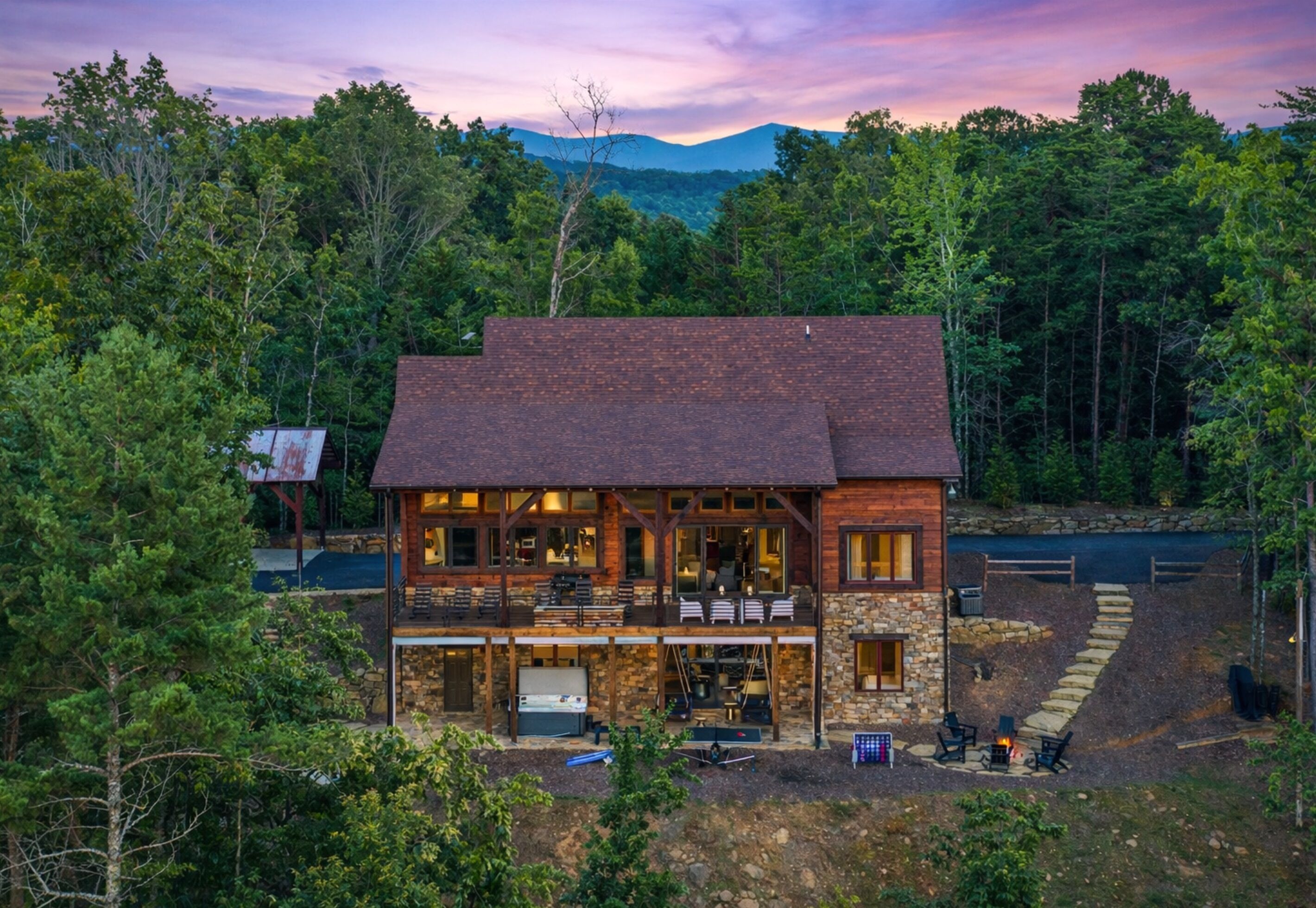 A serene mountain retreat with breathtaking views, cozy outdoor seating, and a relaxing hot tub. The perfect getaway for nature lovers!