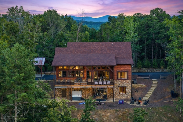 A serene mountain retreat with breathtaking views, cozy outdoor seating, and a relaxing hot tub. The perfect getaway for nature lovers!