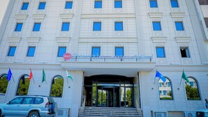 A large, white building with multiple windows and a sign that reads "Premier Residence Hotel". - Best Western Premier Dj Hotel (Djibouti)