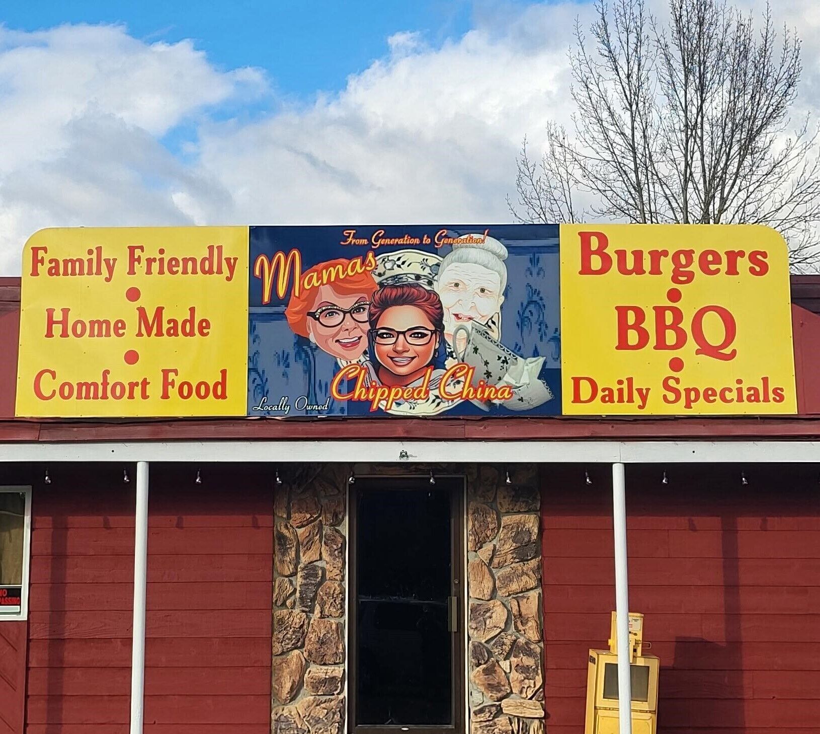 A restaurant with a sign advertising 'Family Friendly Home Made Comfort Food' and 'Burgers BBQ Daily Specials'.