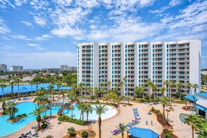 Enjoy a refreshing swim in the hotel's multiple pools surrounded by palm trees.