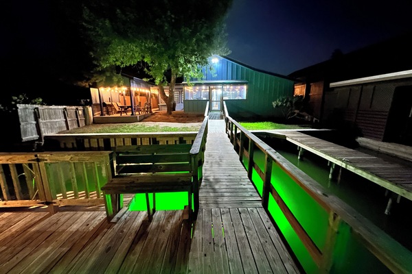 Night View from Dock to back patio/porch area