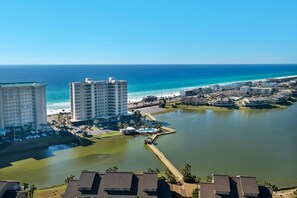 A coastal resort area with high-rise buildings, a marina, and a beach. - Ariel Dunes II 2006 (Miramar Beach)