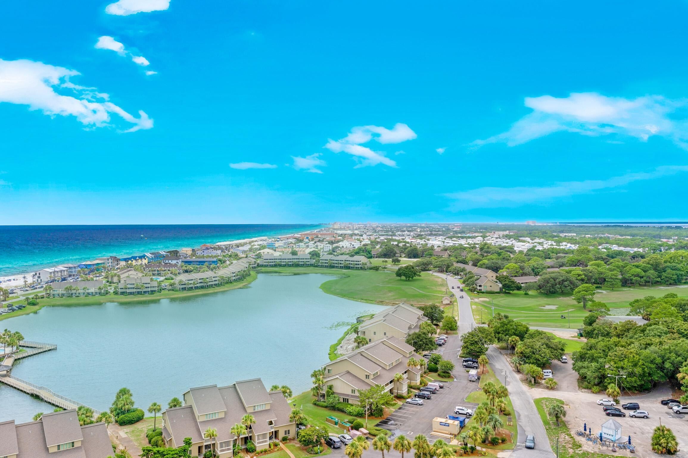 A coastal resort with a marina, golf course, and beachfront views.