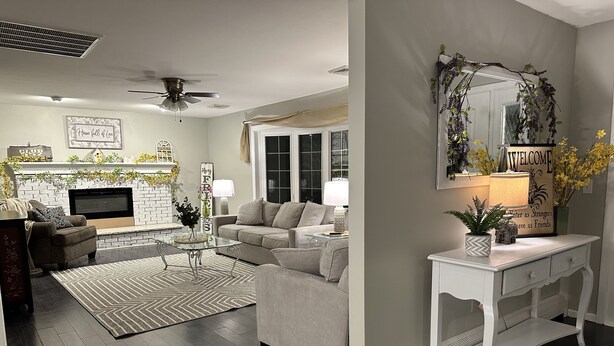A modern living room with a fireplace, a sofa, a coffee table, and a TV. - Quiet & cozy home, bring the whole family. (Monroe Township)