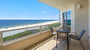 A balcony with a view of the beach and ocean. - Enclave 506 (Orange Beach)