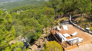 A wooden deck with lounge chairs overlooking a mountainous landscape. - Double Family Villa,12 people with Pool near Cannes (Fréjus)