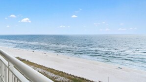 A beach with a clear sky and calm sea. - Indigo West 1104 (Pensacola)