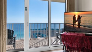 A balcony with a view of the ocean and a resort building. - Ariel Dunes I 2008 (Miramar Beach)
