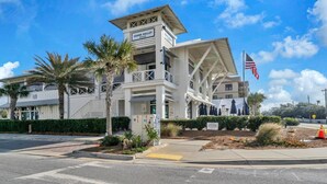 A white building with a sign reading "Shank Gulley" and a flag. - Topsail Village 422 (Santa Rosa Beach)
