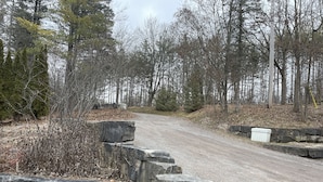 A gravel road flanked by stone walls and trees. - Relax and Rejuvinate at the cottage.  Get some forest therapy. (Bridgenorth)