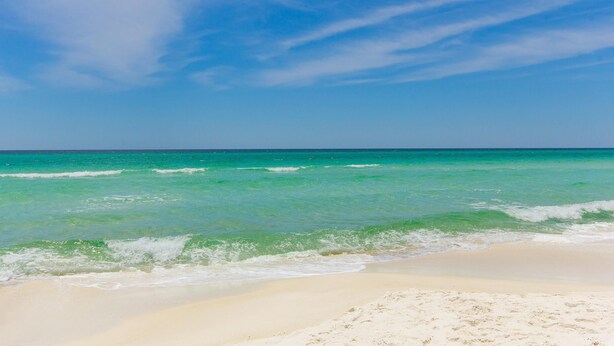 A beach with clear turquoise water and a sandy shore. - Inlet Sands 206- Inlet Dreams (Panama City Beach)