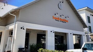 A building with a sign reading "Local Cantina Tacos & Tequila." - Four Fish Bungalow 155 (Santa Rosa Beach)