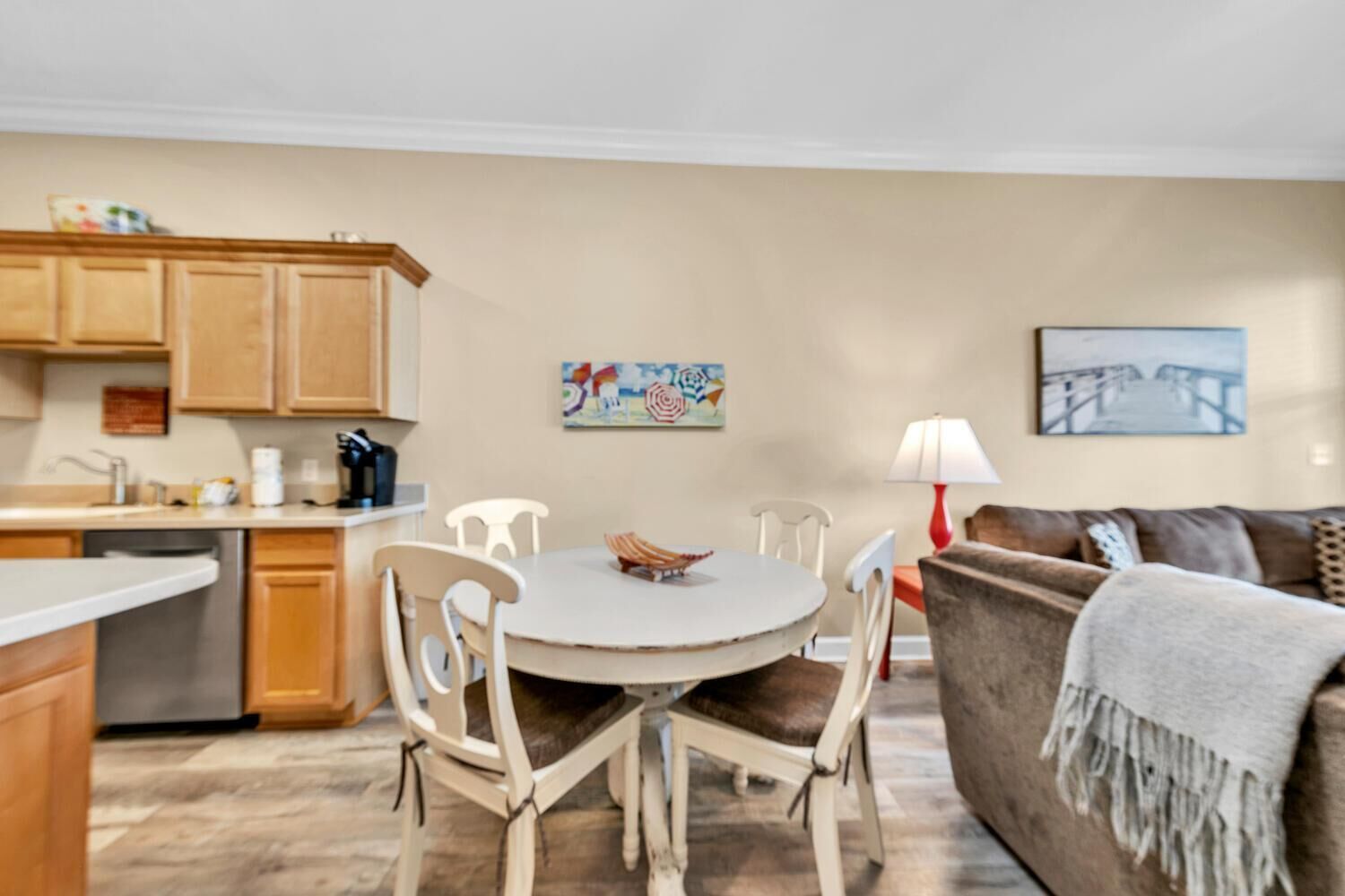 A compact living space with a kitchen, dining area, and seating area.