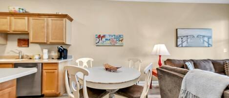 A compact living space with a kitchen, dining area, and seating area.