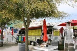 Enjoy a variety of food options at this outdoor food truck, offering a range of dishes for all tastes.