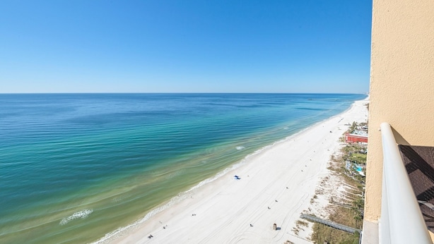 A beach view from a balcony with a clear sky. - Majestic Beach Towers 1-2314 (Panama City Beach)