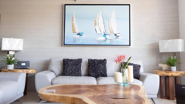 A modern living room with a sofa, coffee table, and artwork. - New Villa Deluxe, Golf Club, Punta Cala 205 (Nuevo Nayarit)