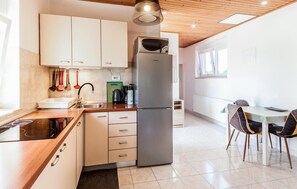 Fridge, stovetop, dishwasher, coffee/tea maker