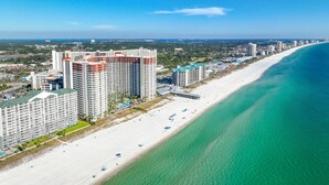 A coastal hotel with multiple high-rise buildings, a beach, and a clear view of the ocean. - Shores of Panama 1212 (Panama City Beach)