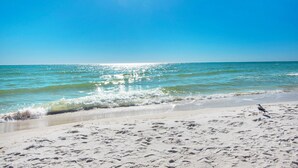 A beach with clear skies and calm waters. - Shores of Panama 2004 (Panama City Beach)