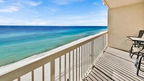 A balcony with a view of clear turquoise waters and a sandy beach. - Celadon 1103 - Beach Paradise (Panama City Beach)