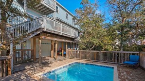 A two-story house with a swimming pool, wooden deck, and a covered patio area. - Blue Mountain Breeze (Santa Rosa Beach)