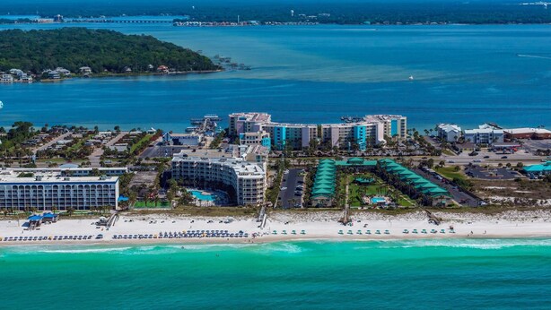A coastal resort with beachfront hotels, a sandy beach, and a marina. - Destin West Gulfside #608 (Fort Walton Beach)
