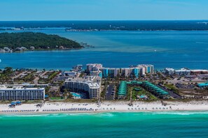 A coastal resort with beachfront hotels, a sandy beach, and a marina. - Destin West Gulfside #608 (Fort Walton Beach)