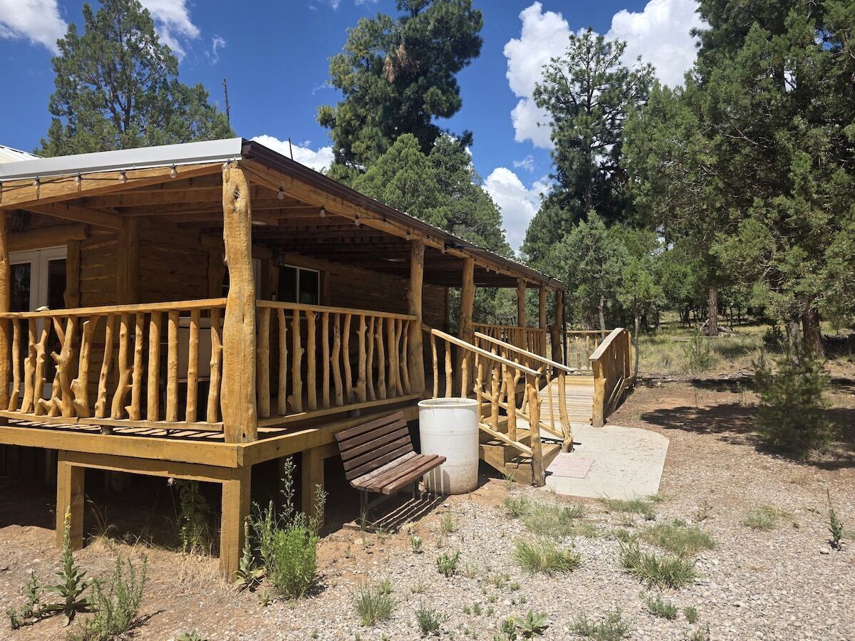 Pawnee Pines exterior with covered forest deck and easy-access ramp.
