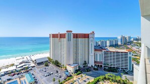 A high-rise hotel with a central tower, a beach, and a parking lot. - Laketown Wharf Penthouse 2026 (Panama City Beach)