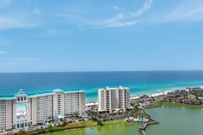 A resort with multiple high-rise buildings, a marina, and a view of the ocean. - Ariel Dunes II 2404 (Miramar Beach)