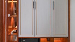 A wardrobe with three doors, a small shelf, and a drawer. - MIMOSA HALONG HOTEL (Ha Long)