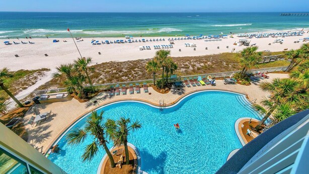 A swimming pool with a view of the beach and ocean. - Aqua Resort 401 - Piece of Serenity (Panama City Beach)