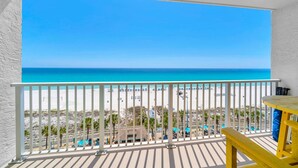 A balcony with a view of a beach and ocean. - The Summit 818 (Panama City Beach)