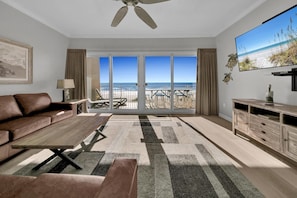 Condo, Multiple Beds (Sterling Beach #406) | Living area | TV - Sterling Beach #406 (Panama City Beach)