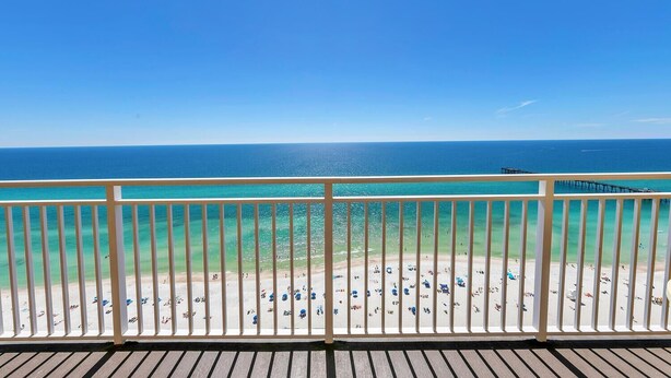 A balcony with a view of a beach and ocean. - Sterling Reef 1904- Penthouse (Panama City Beach)