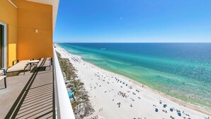 A balcony with a view of a beach and ocean. - Sterling Reef 1904- Penthouse (Panama City Beach)
