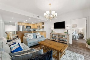 Relax in this inviting space with a comfortable sofa, coffee table, and flat-screen TV.