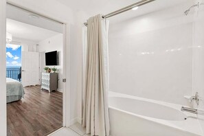Enjoy a refreshing soak in the bathtub or invigorate with a shower, with a TV for entertainment nearby.