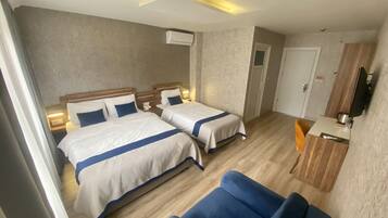 Deluxe Quadruple Room | Minibar, in-room safe, iron/ironing board, free WiFi