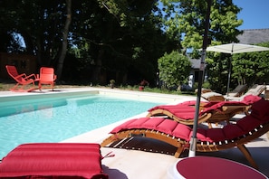 Seasonal outdoor pool, open 10:00 AM to 7:00 PM, pool umbrellas