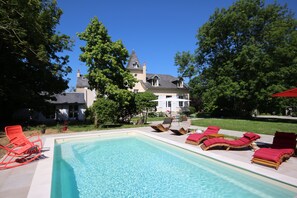 Seasonal outdoor pool, open 10:00 AM to 7:00 PM, pool umbrellas