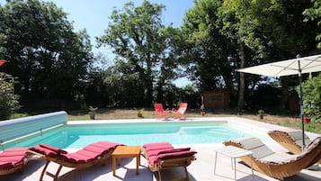 Seasonal outdoor pool, open 10:00 AM to 7:00 PM, pool umbrellas