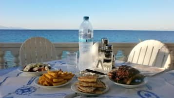 Breakfast, lunch, dinner served; beach views