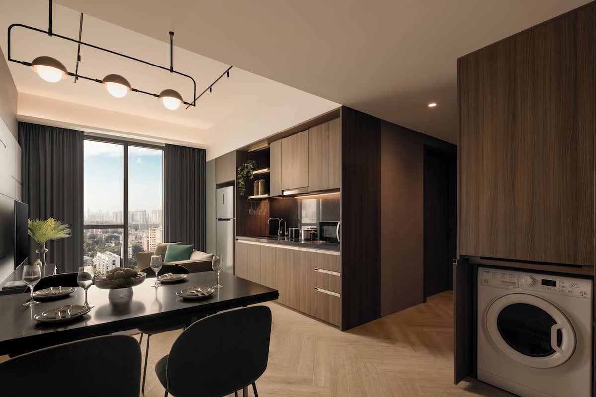 A modern kitchen with a built-in washer and dryer, a dining area with a table set for two, and a large window offering a city view.