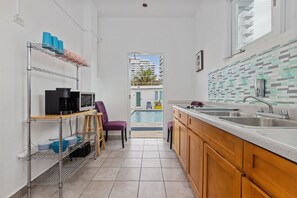 Fridge, microwave, stovetop, coffee/tea maker