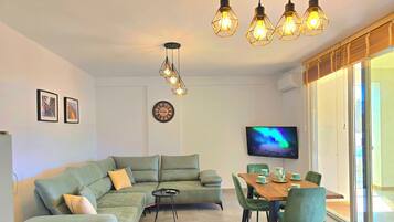 Family Apartment, 2 Bedrooms, Balcony (Cozy Apartment in San Pietro Resort) | Living area | Smart TV
