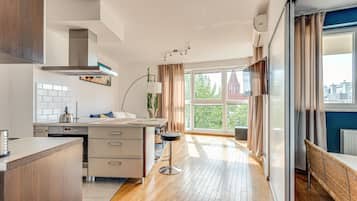 Deluxe Apartment | Living area | 37-inch flat-screen TV with digital channels