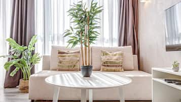 Comfort Apartment | Living room | 37-inch flat-screen TV with digital channels